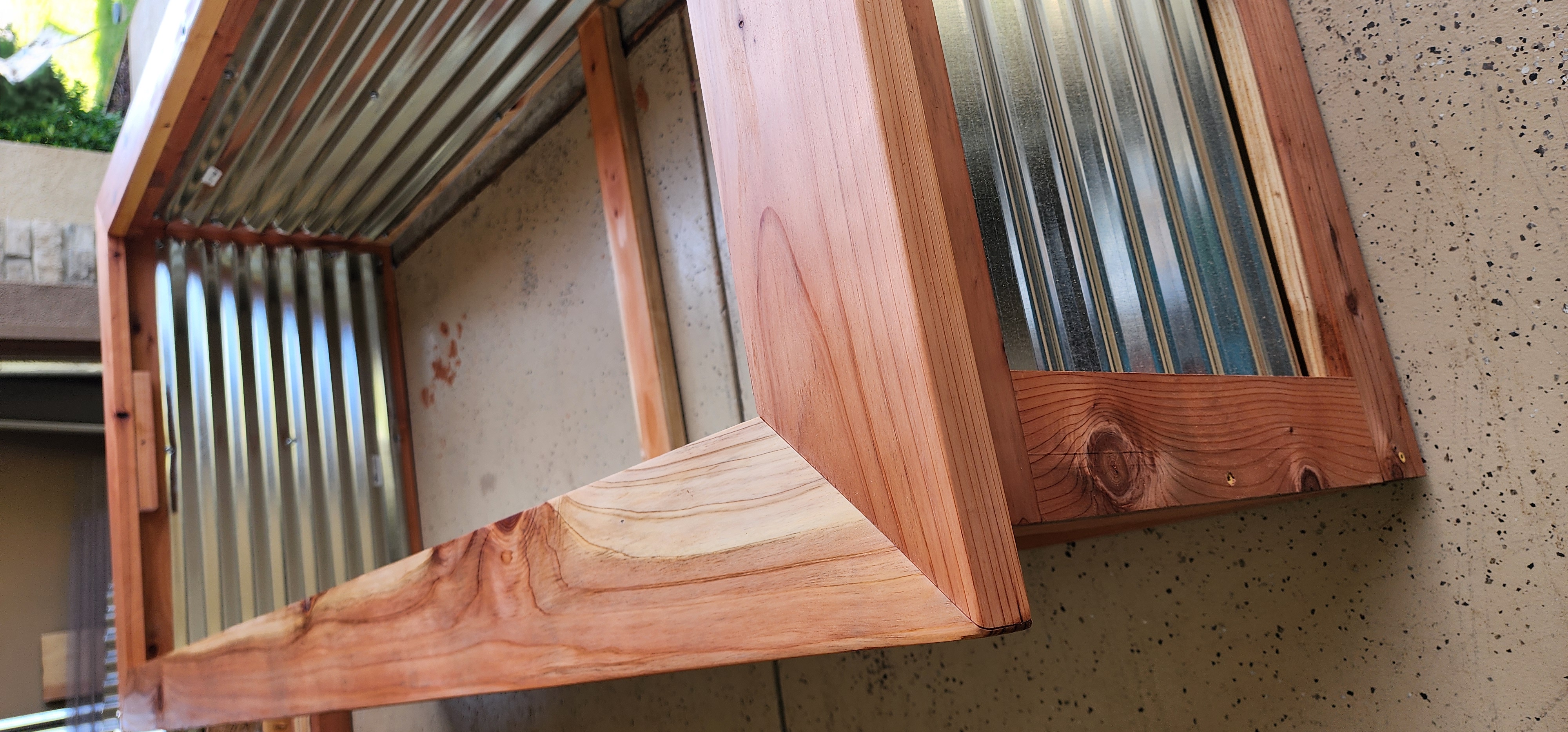 Vertical shot of a tall redwood planter