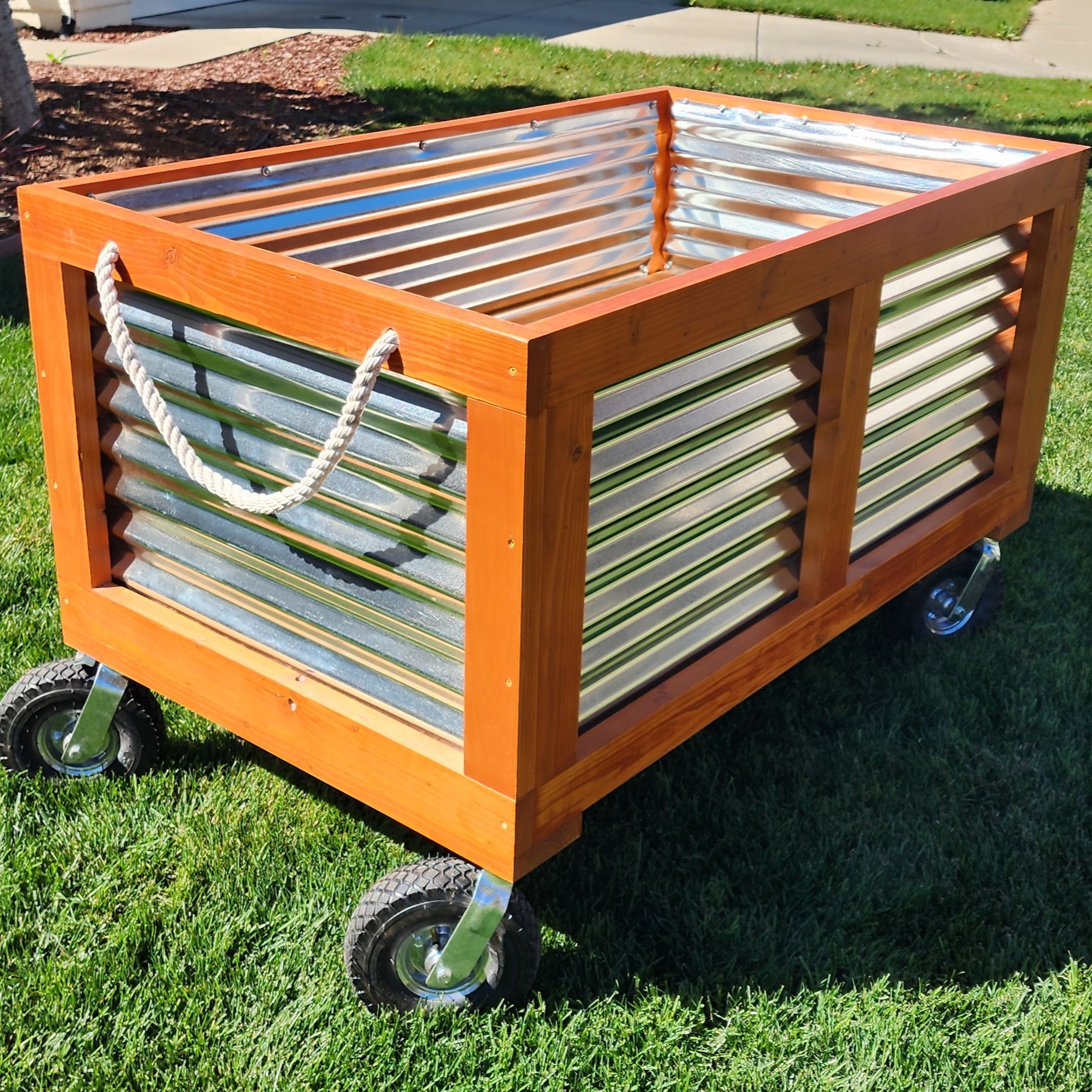 Stained raised garden bed on wheels