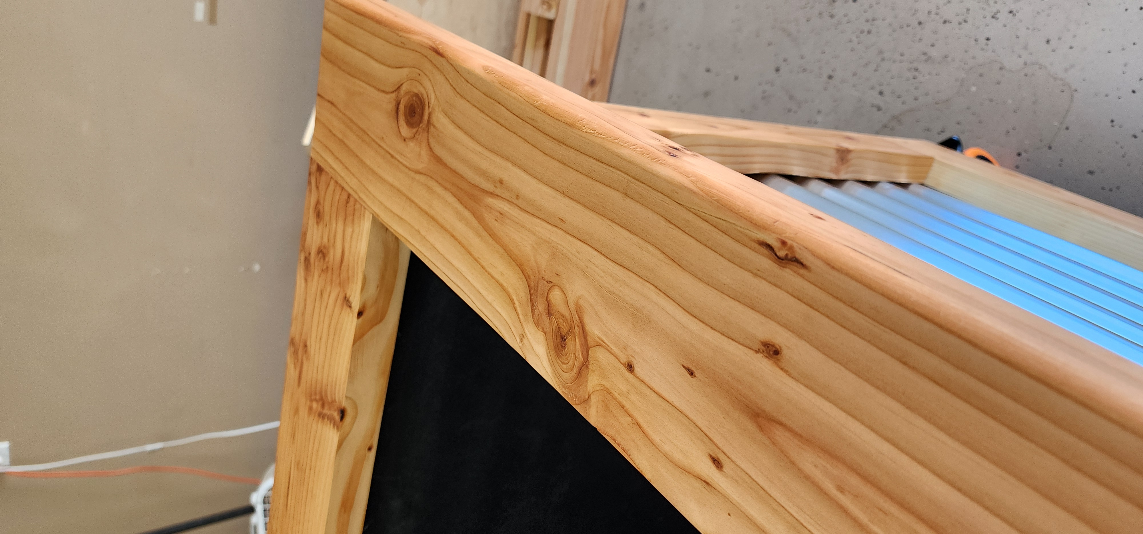 Raised bed with cedar ledge and trellis
