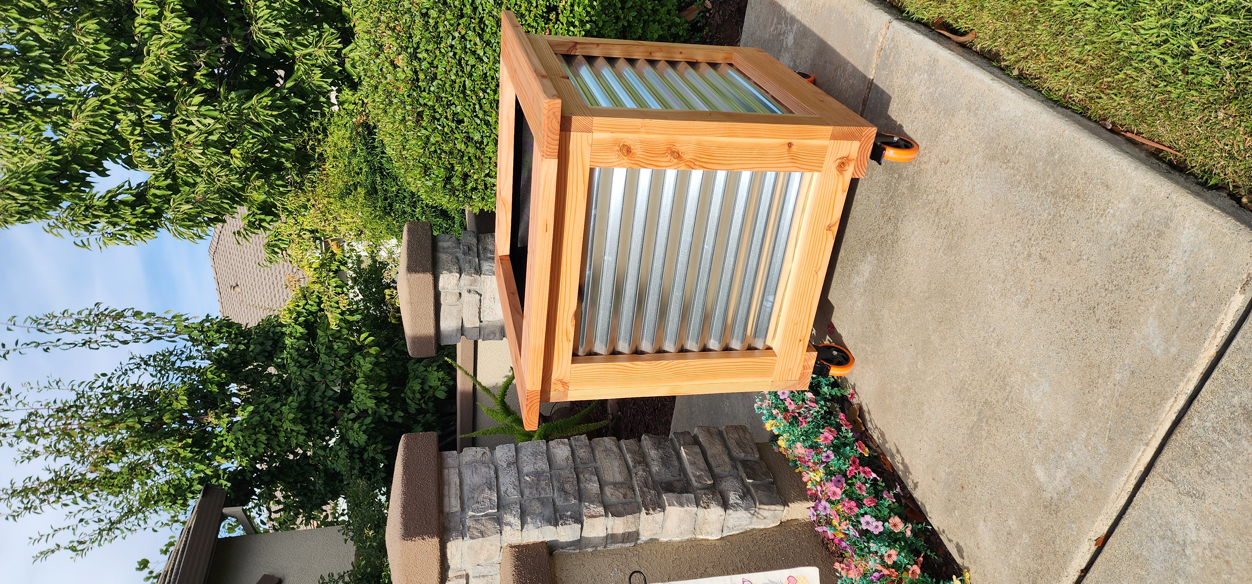 Three matching tall planters on display